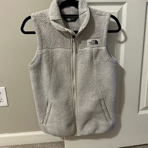Size small north face fuzzy vest; great condition; no stains or tears